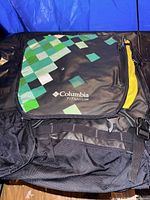Front view showing Columbia Titanium logo and green pixel design