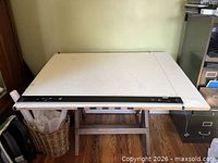 Top view showing white drafting surface and straightedge