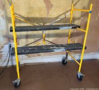 Scaffold assembled with two platforms and four casters