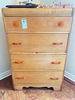 Full frontal view showing dresser, five-drawer arrangement, handles, overall finish
