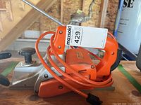 Side view of Black & Decker electric hand planer with cord showing overall condition