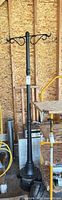 Full view of lamp post with scrollwork arms