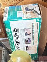 Closed retail box of Chamberlain model 248735 chain-drive 3/4 HP garage door opener
