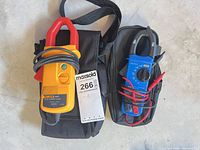 Fluke i410 clamp and blue clamp meter in their cases