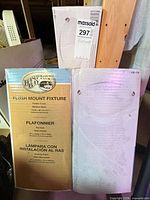 Front of Hampton Bay flush mount fixture boxes showing brand and specifications