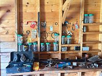 Overall view of shelves with jars, toolbox, loose hardware