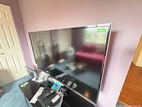 Front angled view of Hisense television showing screen and surrounding bezel