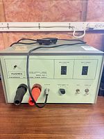 Front view showing brand, model, connectors, controls, foot pedal on top