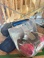 Respirator in clamshell package, part of vacuum visible