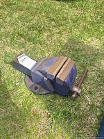Full view of blue Mastercraft bench vise showing jaws, handle and base