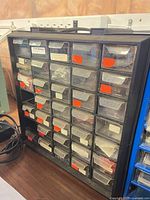 Front view of Philips ECG 36-drawer organizer showing clear drawers with labels and contents