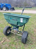 Full view of Yard Commander spreader showing hopper, frame and handle