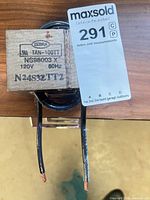 Zebra transformer showing model numbers TAN-100TT, NS98003 X, N24S32TT2 and stripped output leads