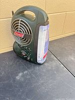 Front view showing Coleman logo, lantern panel, radio controls