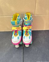 Front view of both roller skates showing color and size