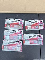 Five of the six sealed Energizer Max AAA 16-packs displayed on table
