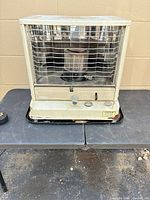 Front view of Fanco kerosene heater showing grill and controls