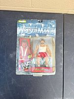 Front of sealed Dr. Death WrestleMania Series 7 figure showing yellowed blister and bent card