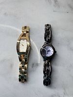 Both Fossil watches side by side