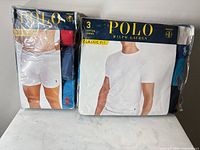 Front view of sealed 3-pack boxer briefs and 3-pack crew neck T-shirts