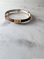 Bracelet closed showing front clasp and logo stations