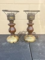 Front view of both matching wood and brass table lamps showing bases, columns, and socket assemblies