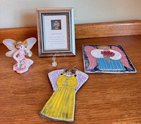 Group view showing five angel décor items together