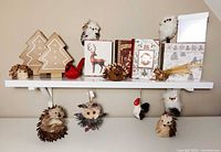 Shelf with assorted holiday ornaments and boxes