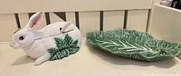 Rabbit covered dish and cabbage-leaf plate displayed together