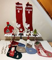 Full lot showing stockings, holders, ornaments, gift bag