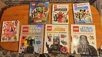 All seven LEGO books laid out front covers visible