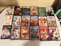 Full layout of 18 DVD cases front covers visible