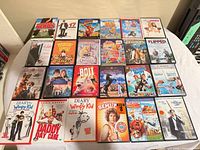 Full layout of 24 DVD cases on tabletop