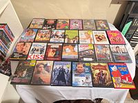 Tabletop view showing all 26 DVD cases arranged in four rows