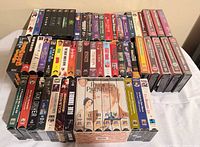 Top view of all stacked VHS tapes showing titles and box sets