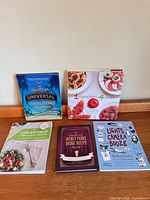 All five books laid out showing covers