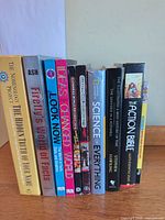 Spines of 10 assorted reference, science and Bible books