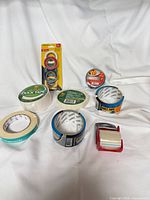 All tape rolls and dispenser laid out on white background