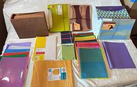 Full lot overview showing organizers, folders, envelopes, paper packs, accessories