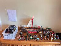Overall view showing longship, figures, horses and accessory basket