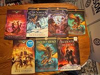 All seven book fronts visible