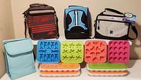 Overview of four lunch bags and ten silicone ice cube molds displayed on shelves