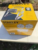 Factory-sealed box of Stanley model 11709 ceramic utility heater showing product image and seals