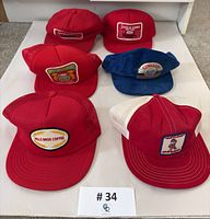 Group of six caps displaying all front logo patches