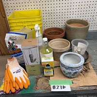 Group shot showing all gardening supplies, planters, gloves, sand, plant food, bins