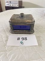 Front view of cobalt glass and metal box showing overall design and size