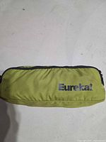 Lime green Eureka! branded carry bag