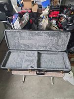 Case open showing gray plush interior and overall layout