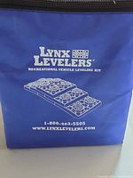 Front of blue Lynx Levelers storage bag