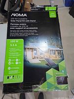 Front of boxed NOMA 100W crystalline solar panel kit